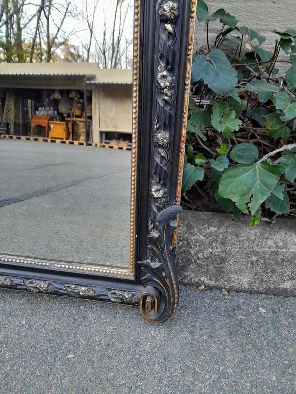 A 20th Century French Style Ebonized Hand-Gilt Ornate Mirror