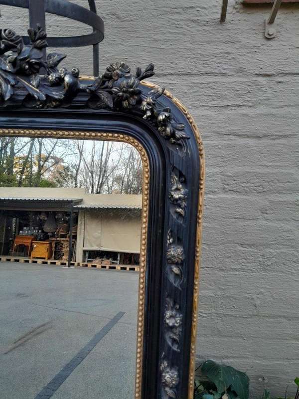 A 20th Century French Style Ebonized Hand-Gilt Ornate Mirror