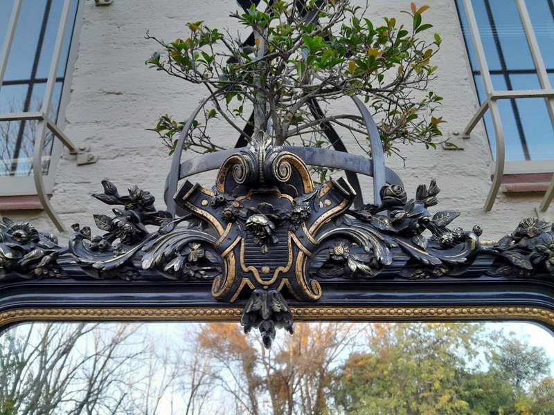 A 20th Century French Style Ebonized Hand-Gilt Ornate Mirror