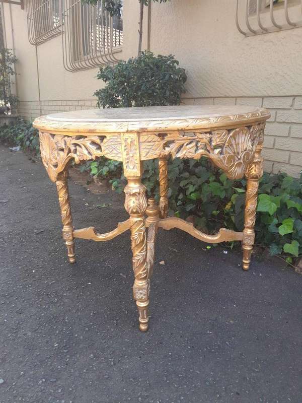 A French Style Ornately Carved and Gilded Wooden Table with Marble Top