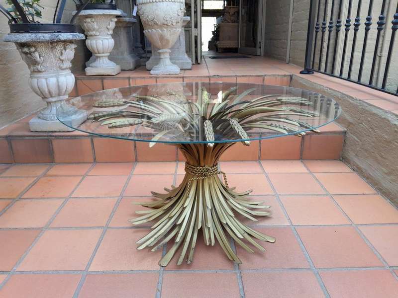 A 20th Century Rare Sculptured Iron Table Base in an Antique Gold Finish with Bevelled Glass Top ...