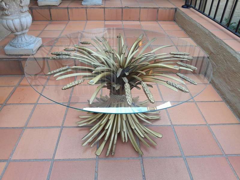 A 20th Century Rare Sculptured Iron Table Base in an Antique Gold Finish with Bevelled Glass Top ...