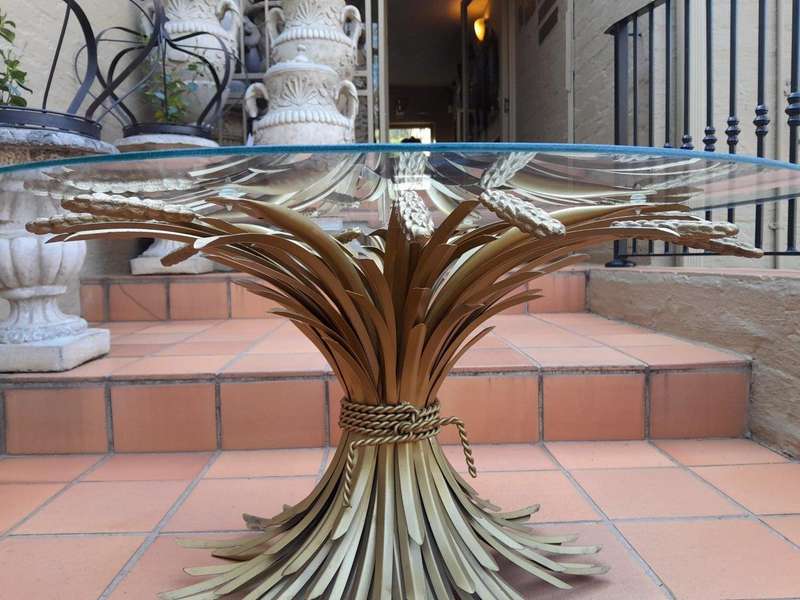 A 20th Century Rare Sculptured Iron Table Base in an Antique Gold Finish with Bevelled Glass Top ...