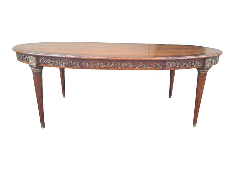 A 20th Century French Style Dining Table with Gold Detail