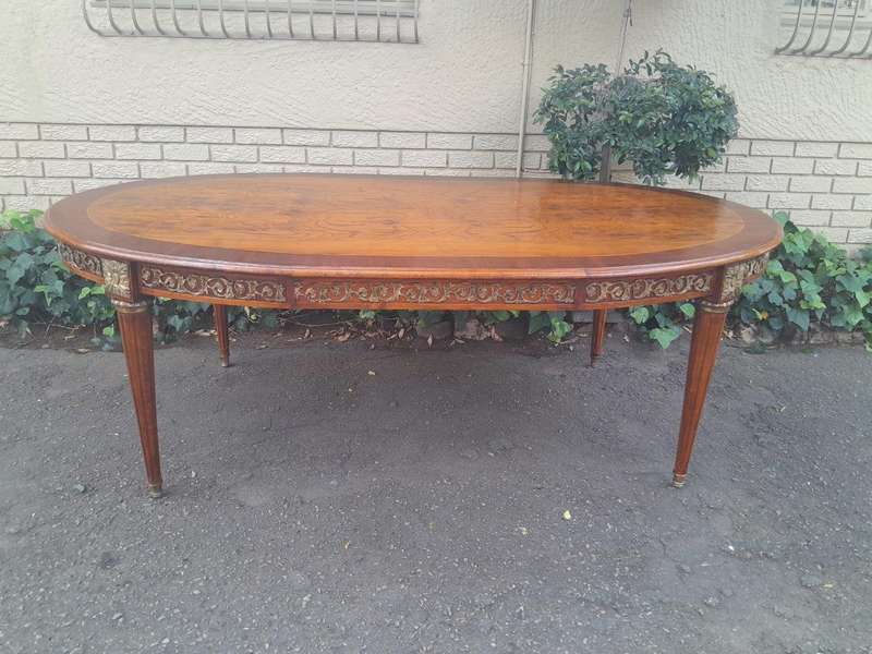 A 20th Century French Style Dining Table with Gold Detail