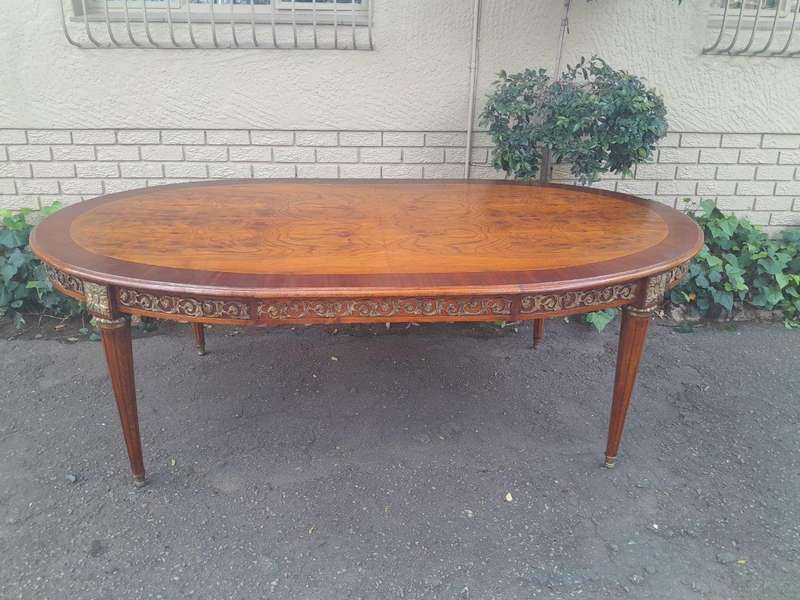 A 20th Century French Style Dining Table with Gold Detail