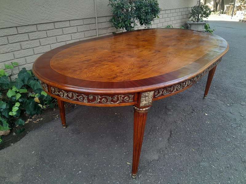A 20th Century French Style Dining Table with Gold Detail