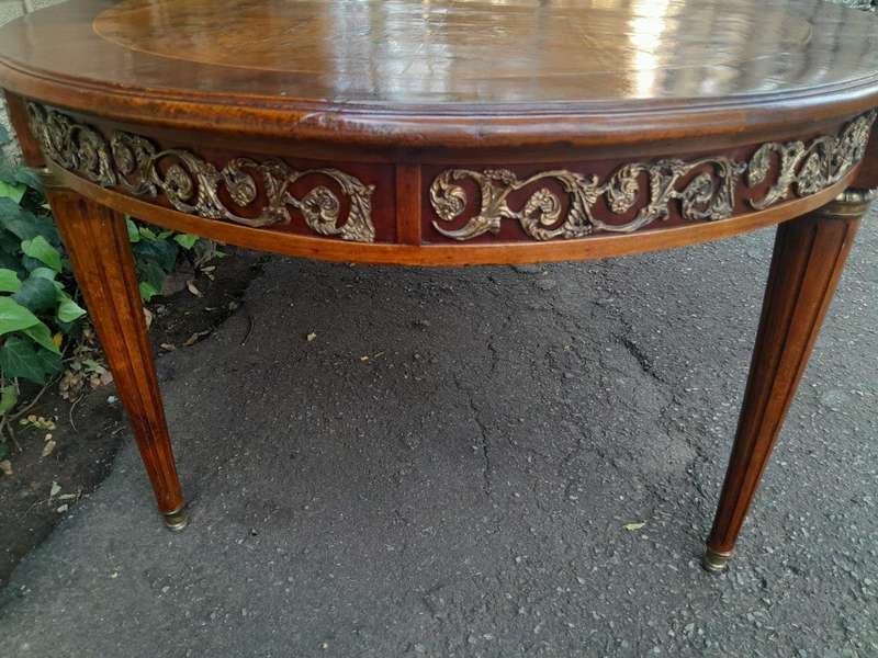 A 20th Century French Style Dining Table with Gold Detail