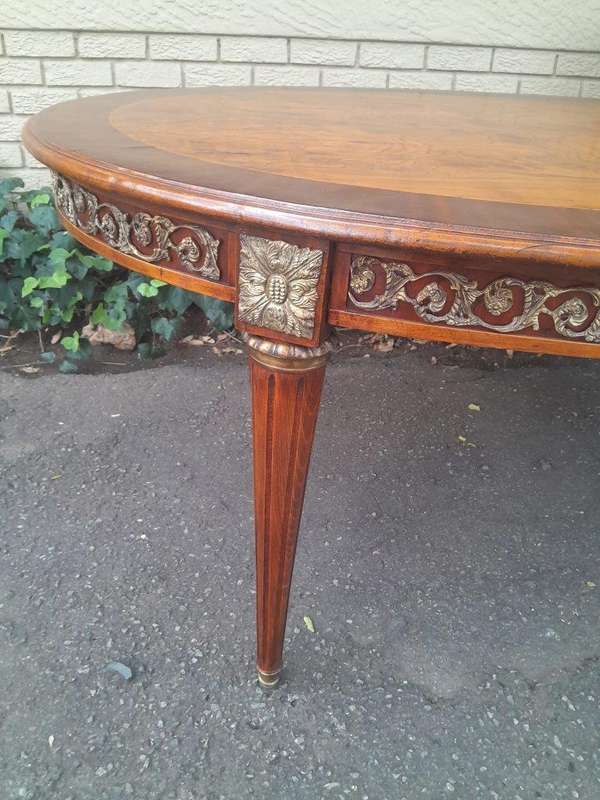 A 20th Century French Style Dining Table with Gold Detail