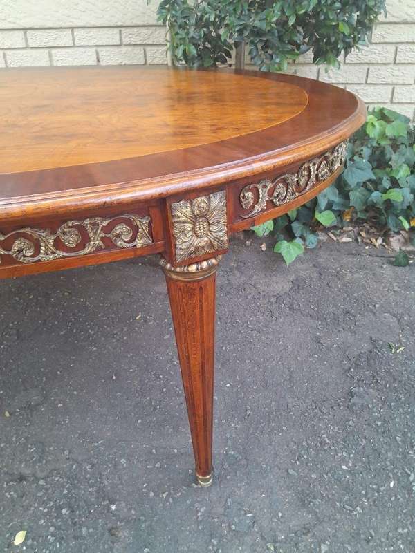 A 20th Century French Style Dining Table with Gold Detail