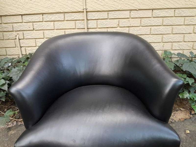 A French Style Pair of Carved Wooden and Hand-Gilded Tub Chairs Upholstered in Black Leather