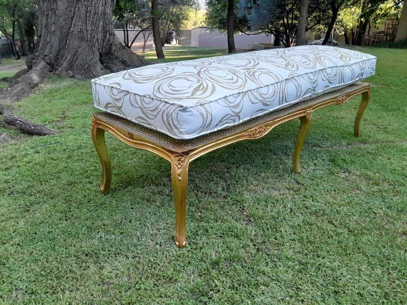 A 20th Century French Style Carved And Gilded Rattan Ottoman /  Bench With Seat Cushion In Hand M...