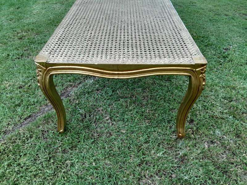 A 20th Century French Style Carved And Gilded Rattan Ottoman /  Bench With Seat Cushion In Hand M...
