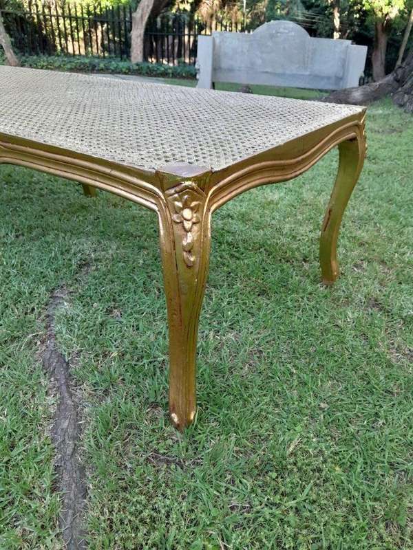 A 20th Century French Style Carved And Gilded Rattan Ottoman /  Bench With Seat Cushion In Hand M...