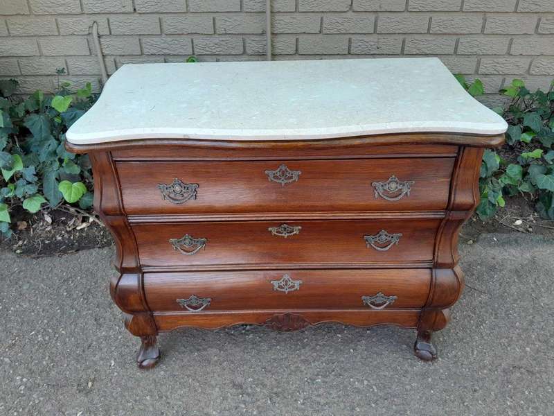 A 19th Century French Provincial Louis XVI-style Oakwood Bombe Chest of Drawers with Galala Cream...