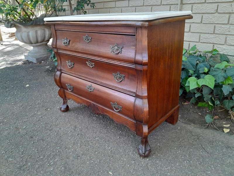 A 19th Century French Provincial Louis XVI-style Oakwood Bombe Chest of Drawers with Galala Cream...