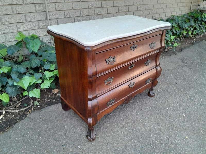 A 19th Century French Provincial Louis XVI-style Oakwood Bombe Chest of Drawers with Galala Cream...