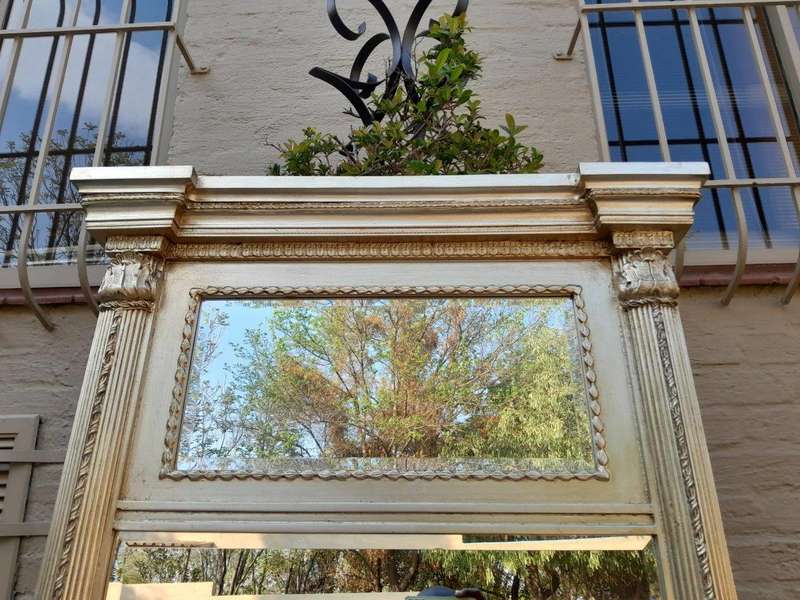 A 20th Century French Empire Style Hand Gilded with Gold Leaf Giltwood Pier Mirror