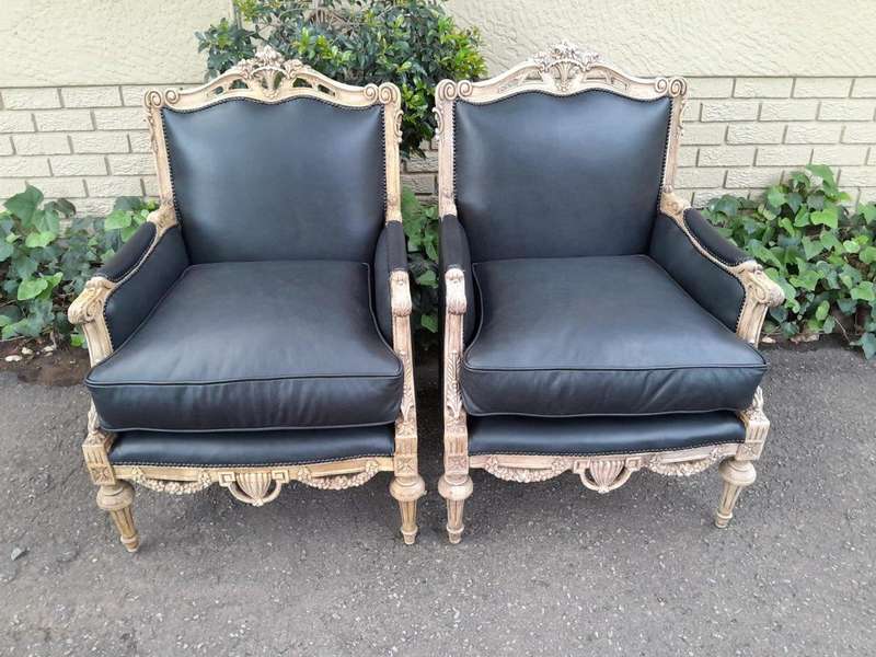 A 20TH Century Pair of French Louis XVI-style Walnut Fauteuils / Armchairs Upholstered in Leather...