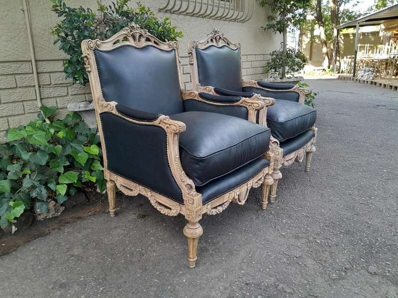 A 20TH Century Pair of French Louis XVI-style Walnut Fauteuils / Armchairs Upholstered in Leather...