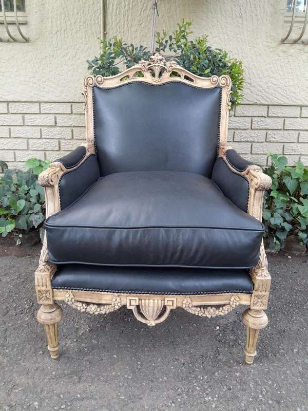 A 20TH Century Pair of French Louis XVI-style Walnut Fauteuils / Armchairs Upholstered in Leather...
