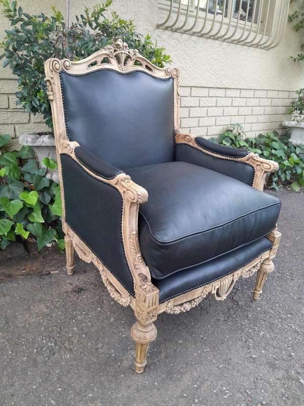 A 20TH Century Pair of French Louis XVI-style Walnut Fauteuils / Armchairs Upholstered in Leather...