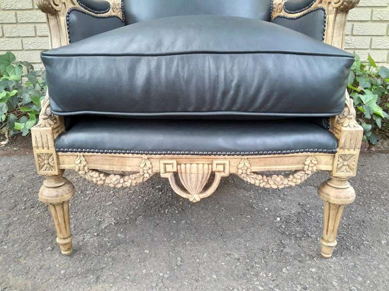 A 20TH Century Pair of French Louis XVI-style Walnut Fauteuils / Armchairs Upholstered in Leather...