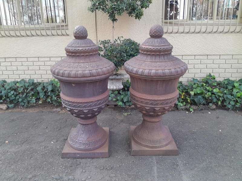 A Rare and Massive Extremely Heavy Pair of Cast Iron Urns with Tops