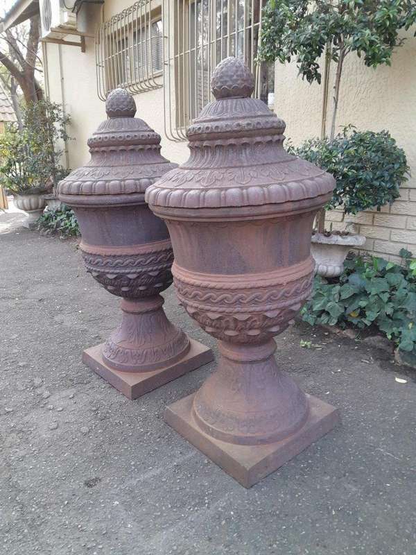 A Rare and Massive Extremely Heavy Pair of Cast Iron Urns with Tops