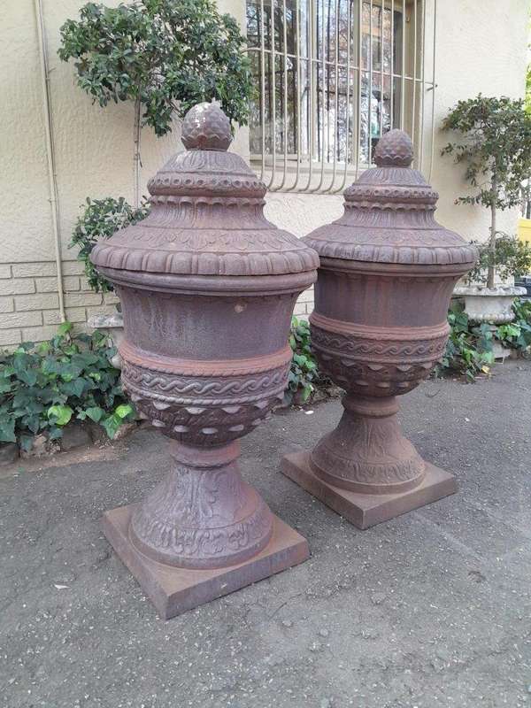 A Rare and Massive Extremely Heavy Pair of Cast Iron Urns with Tops