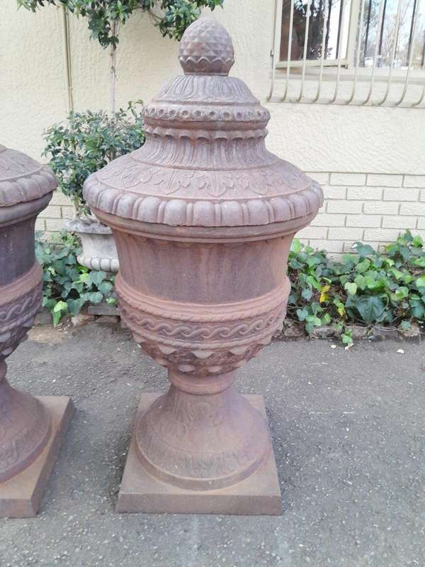 A Rare and Massive Extremely Heavy Pair of Cast Iron Urns with Tops