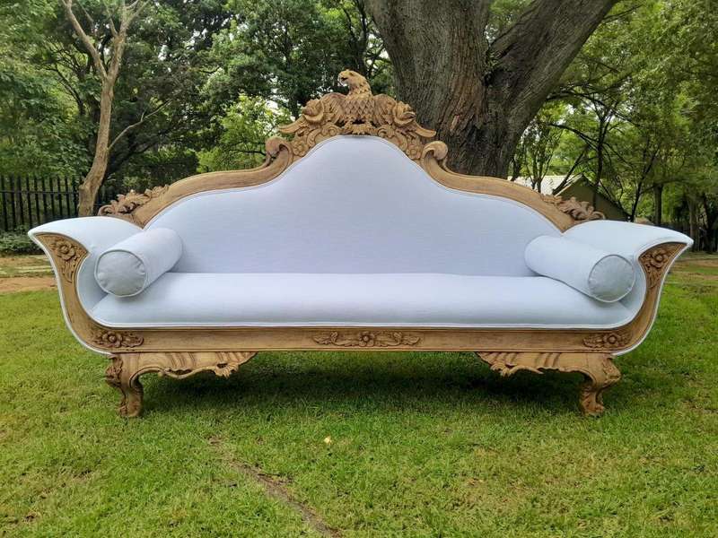 A 20th Century Ornately  Carved Eagle Settee In A Bleached Contemporary Finish Upholstered In A ...