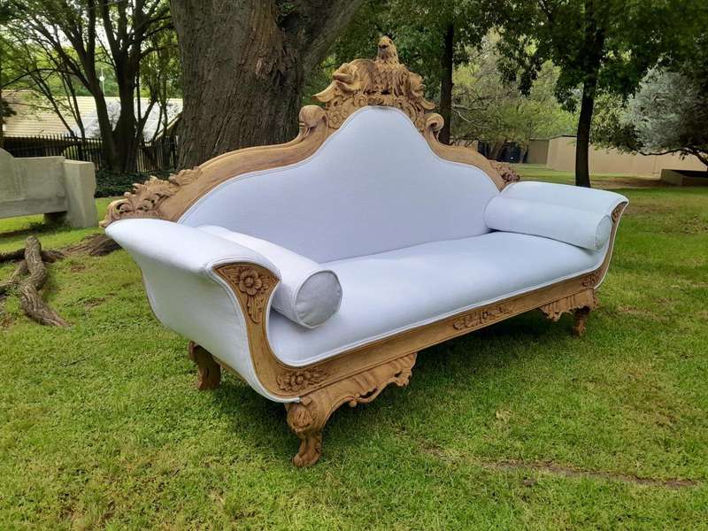 A 20th Century Ornately  Carved Eagle Settee In A Bleached Contemporary Finish Upholstered In A ...