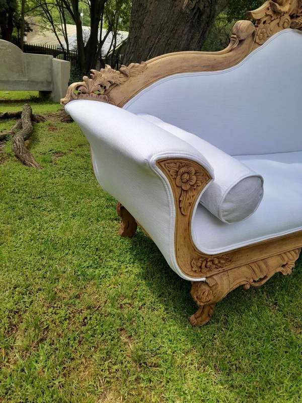 A 20th Century Ornately  Carved Eagle Settee In A Bleached Contemporary Finish Upholstered In A ...
