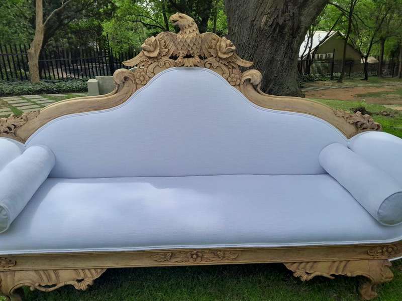 A 20th Century Ornately  Carved Eagle Settee In A Bleached Contemporary Finish Upholstered In A ...