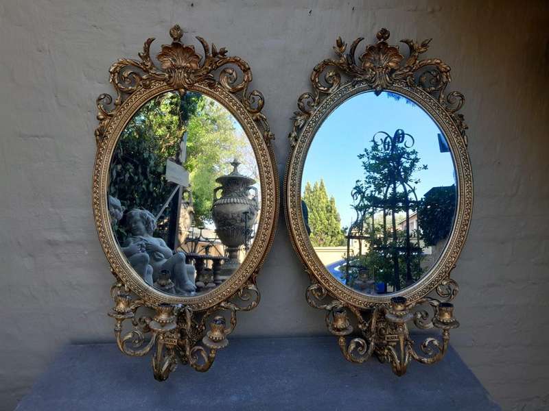 A Rare Pair of 19th Century Ornately Carved and Gilded Mirrors of Large Prroportion