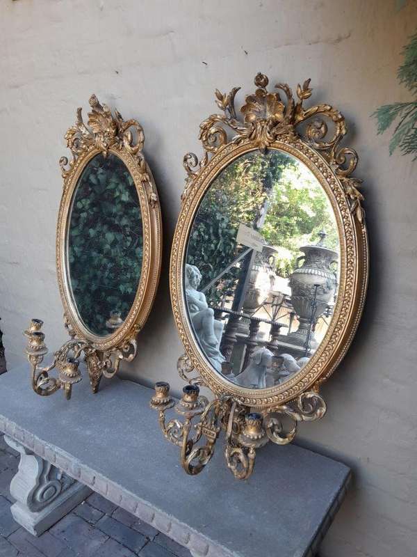 A Rare Pair of 19th Century Ornately Carved and Gilded Mirrors of Large Prroportion