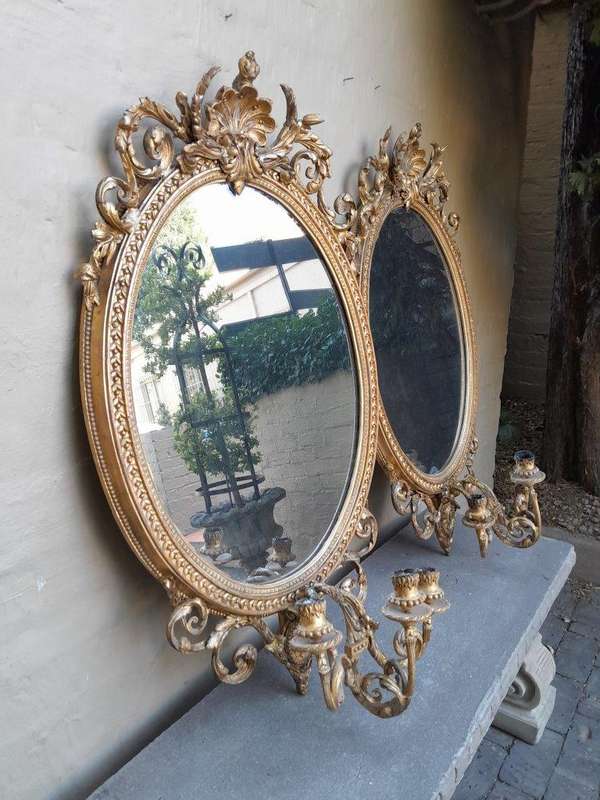 A Rare Pair of 19th Century Ornately Carved and Gilded Mirrors of Large Prroportion