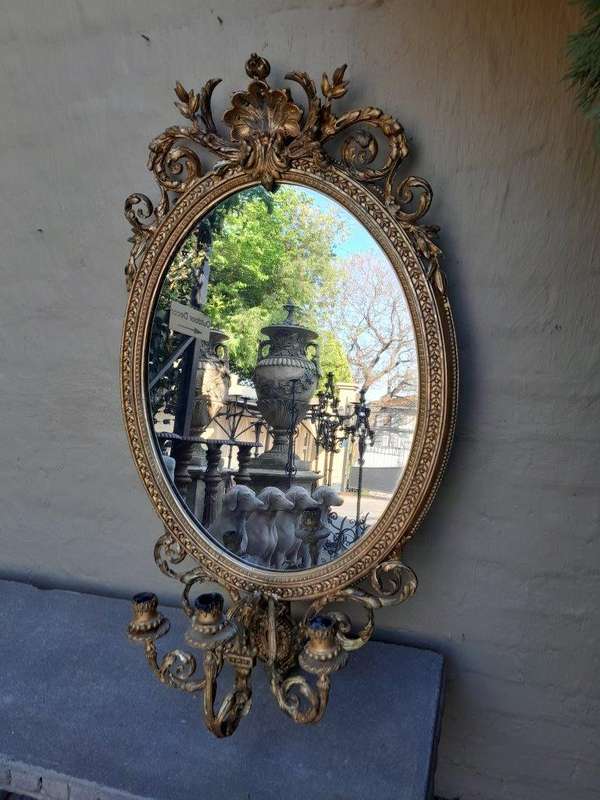 A Rare Pair of 19th Century Ornately Carved and Gilded Mirrors of Large Prroportion