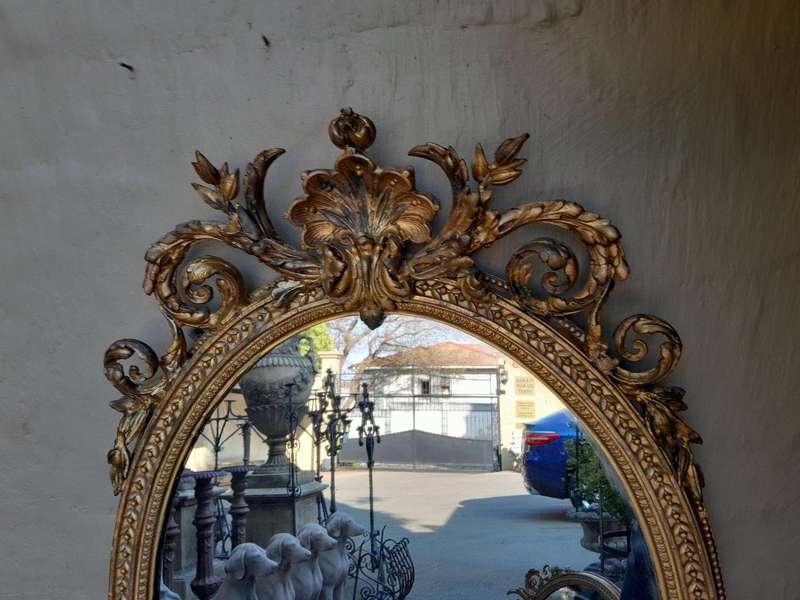A Rare Pair of 19th Century Ornately Carved and Gilded Mirrors of Large Prroportion