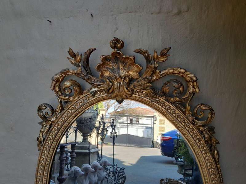 A Rare Pair of 19th Century Ornately Carved and Gilded Mirrors of Large Prroportion