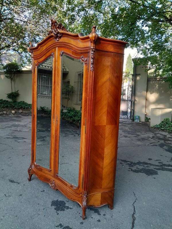 A 20th Century French Louis XV Style Walnut Armoire with Bevelled Mirrors