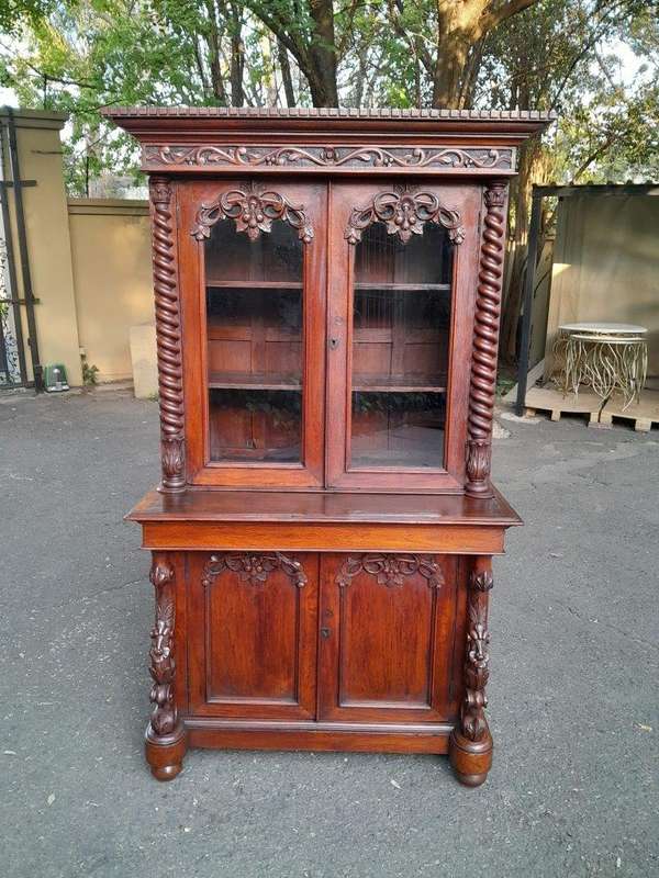 A 19th Century Victorian Carved Mahogany Bookcase Cabinet display / bookcase cabinet with Glazed ...