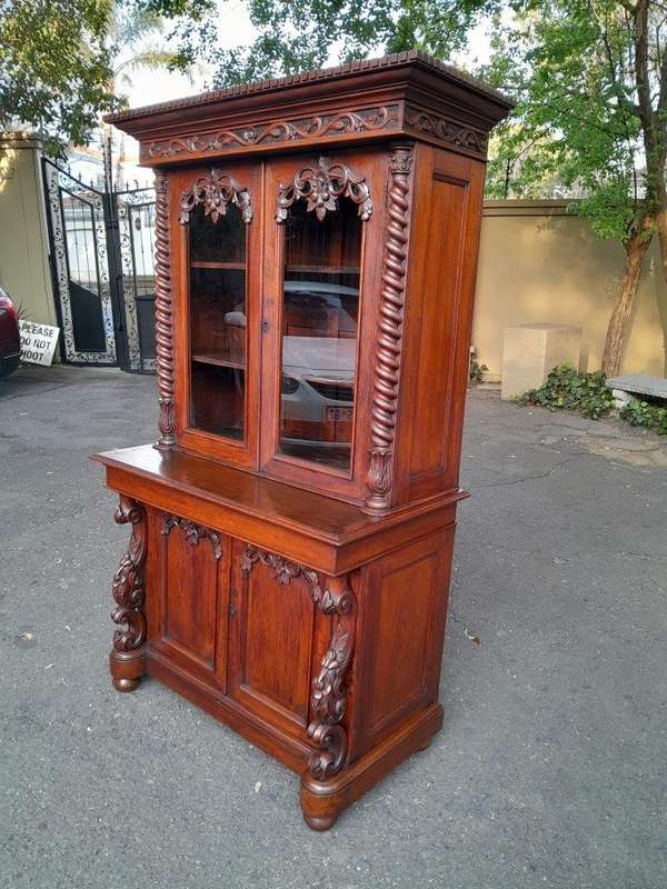 A 19th Century Victorian Carved Mahogany Bookcase Cabinet display / bookcase cabinet with Glazed ...