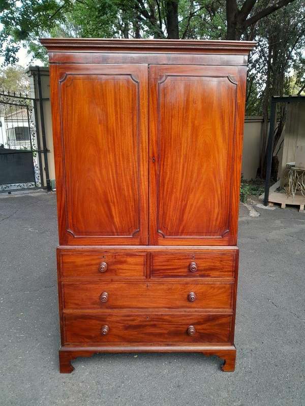 An Early 800s George III Linen Press Cupboard with Patina
