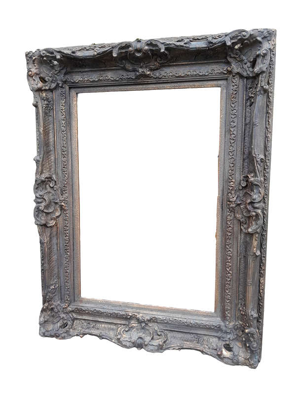 A 20th Century French Style Heavily Carved And Gilded Mirror