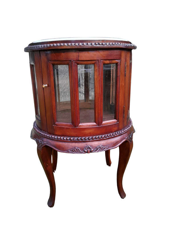 A 20th Century Victorian Ornately Carved Mahogany Drinkscabinet With Cream Marble Top