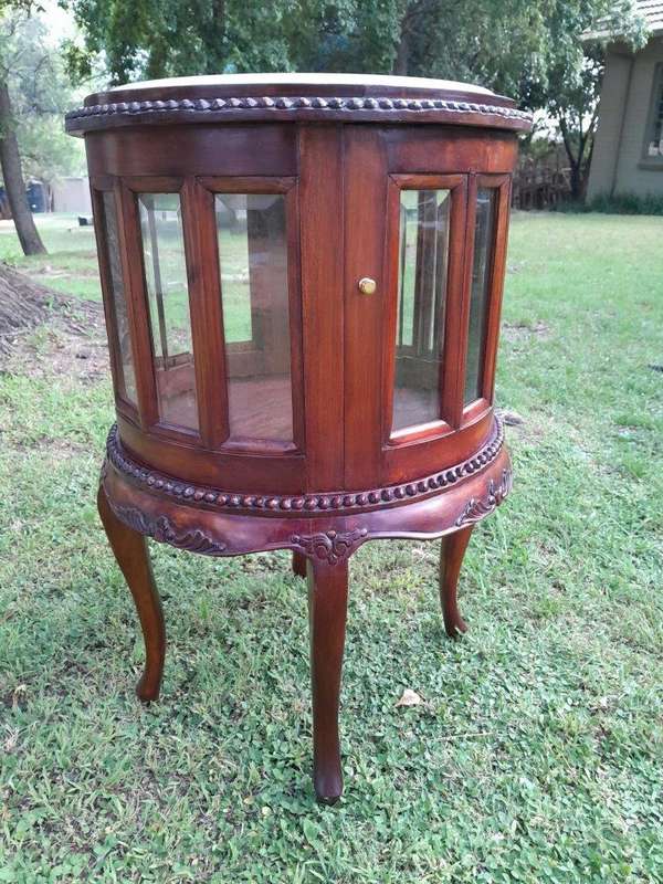 A 20th Century Victorian Ornately Carved Mahogany Drinkscabinet With Cream Marble Top