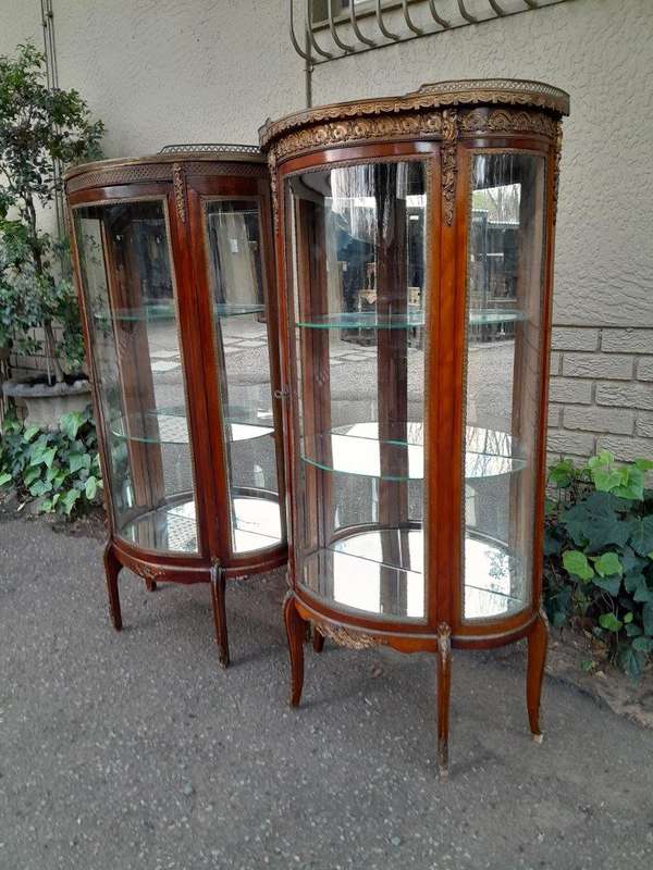 A Rare Near Pair of 20th Century French Style Vitrine / Display Demi Lune Cabinets With Brass Gal...