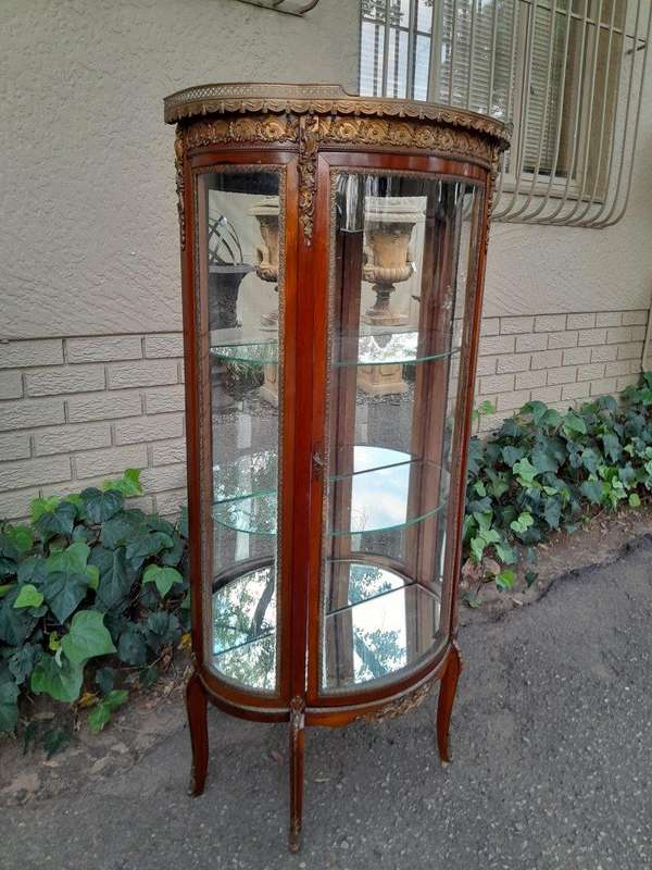 A Rare Near Pair of 20th Century French Style Vitrine / Display Demi Lune Cabinets With Brass Gal...